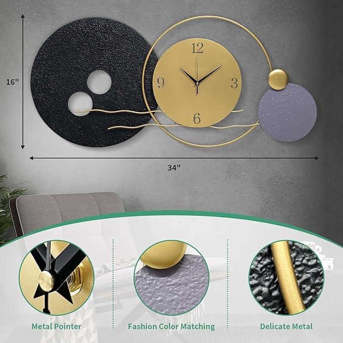 Decorative wall clock with black, gold, and gray elements on a gray wall.