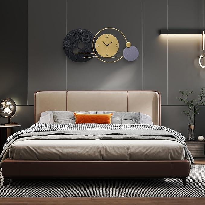 Modern bedroom with a bed, decorative wall clock, and side table.