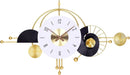 Decorative wall clock with gold and black design on a white background