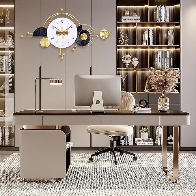 Modern office desk with computer, lamp, and decorative items in a stylish room.