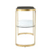 Gold console table with black top and glass shelves on a white background