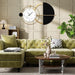 Modern living room with green sofa, round wooden coffee table, and decorative wall clock.