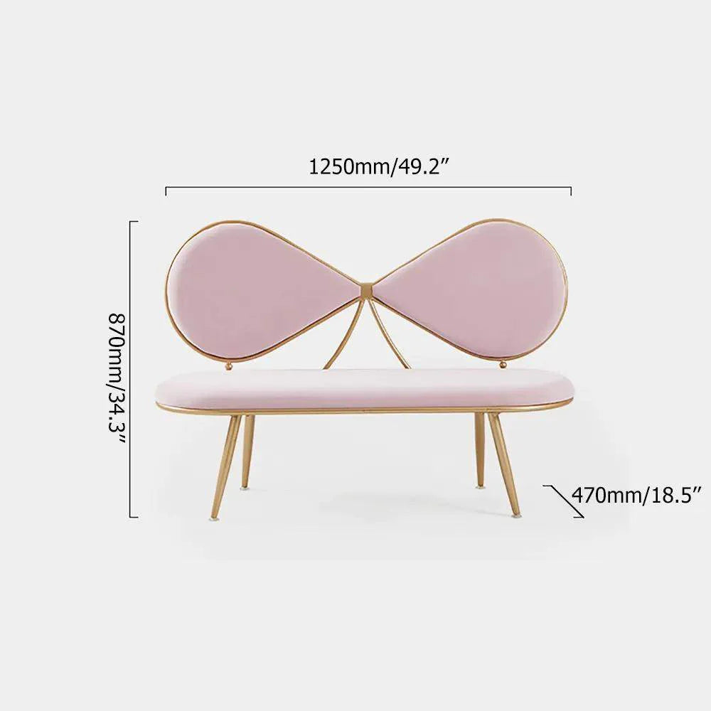 Pink bow-shaped bench with gold accents and dimensions on a white background