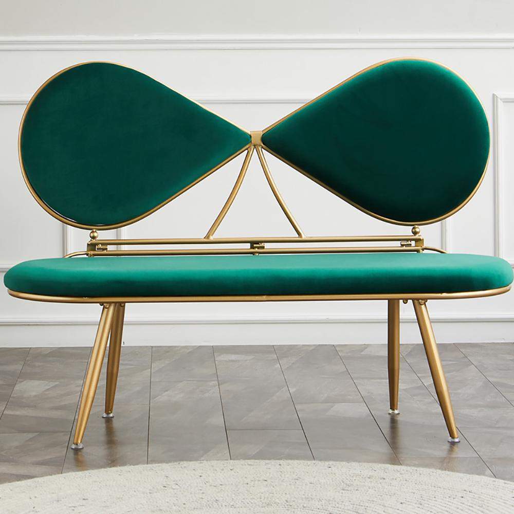 Modern green bench with gold frame on a gray tiled floor