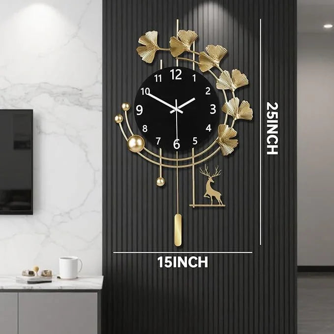Decorative wall clock with gold leaf design on a black wall, showing dimensions.