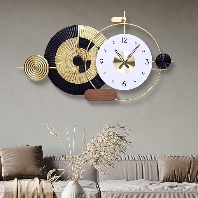Decorative wall clock with geometric design on a gray wall above a sofa.