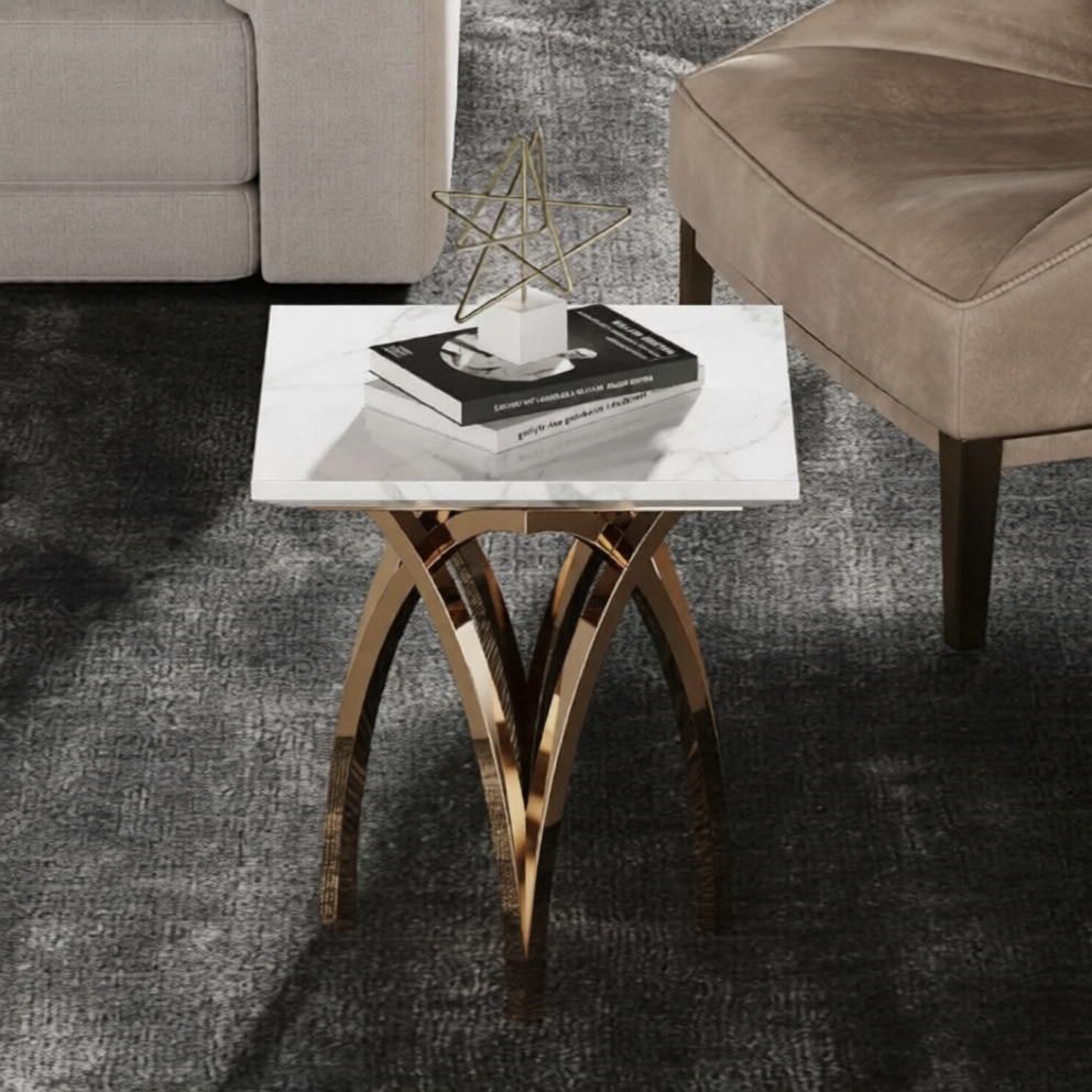 Modern side table with marble top and gold metal legs in a living room setting.