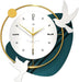 Decorative wall clock with gold accents and white birds on a white background