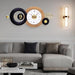 Modern living room with a stylish wall clock and decorative light fixture.