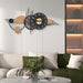 Decorative wall clock with gold accents on a living room wall
