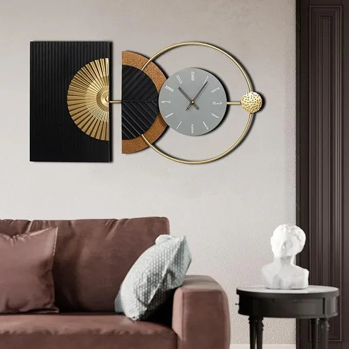 Decorative wall clock with artistic design on a wall above a brown sofa.