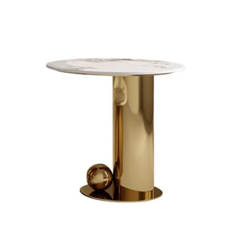 Gold cylindrical side table with marble top on a white background