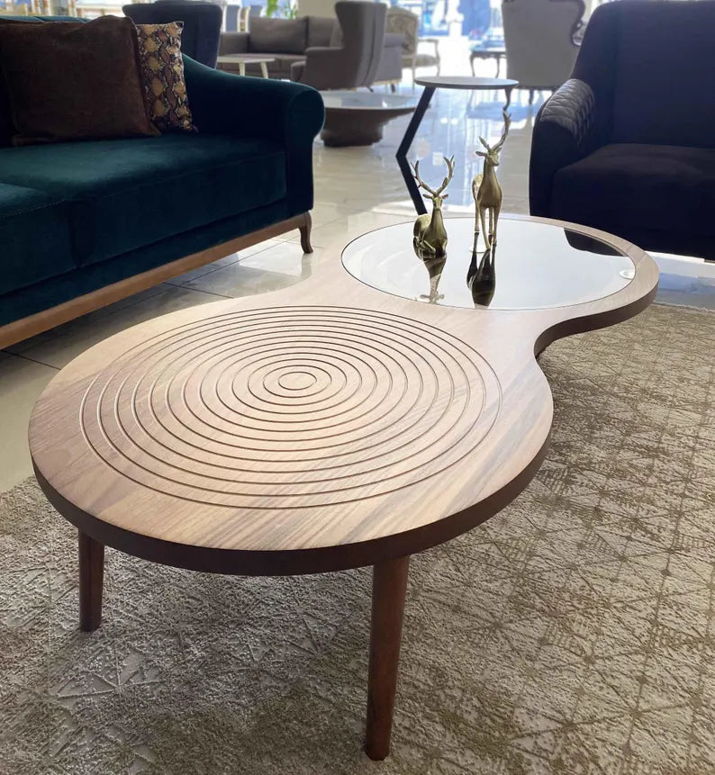 Wooden coffee table with concentric circle design in a living room setting