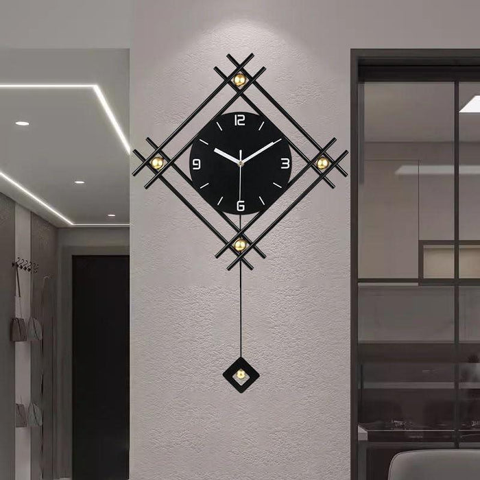 Decorative wall clock with geometric design on a wall.