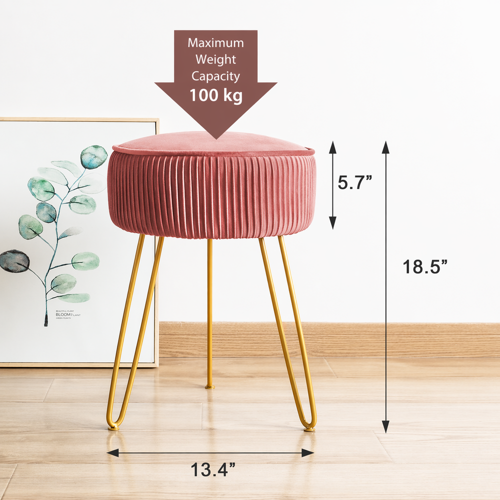 Pink stool with gold legs and measurements on a light wooden floor.