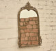 "side view of the vintage wall mirror"
