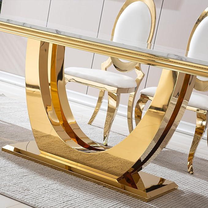 Gold dining table with marble top in a room setting