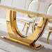 Gold dining table with marble top in a room setting
