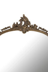 Decorative mirror with an ornate gold frame on a white background