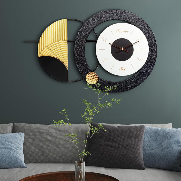 Decorative wall clock with geometric design on a gray wall above a sofa.