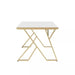 table with a white marble top and gold metal frame on a white background