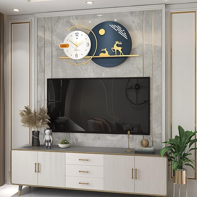 Modern living room with a TV, decorative wall clock, and plants.