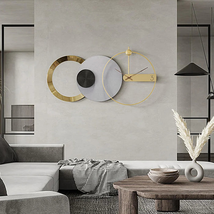 Modern living room with a stylish wall clock and decor elements.