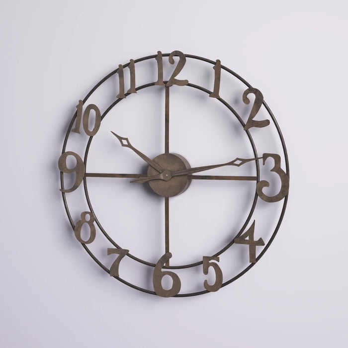 Bronze wall clock with Roman numerals on a light gray background