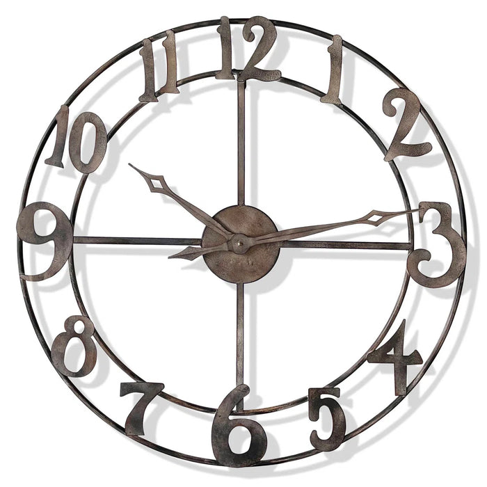 Decorative wall clock with metallic finish on a white background