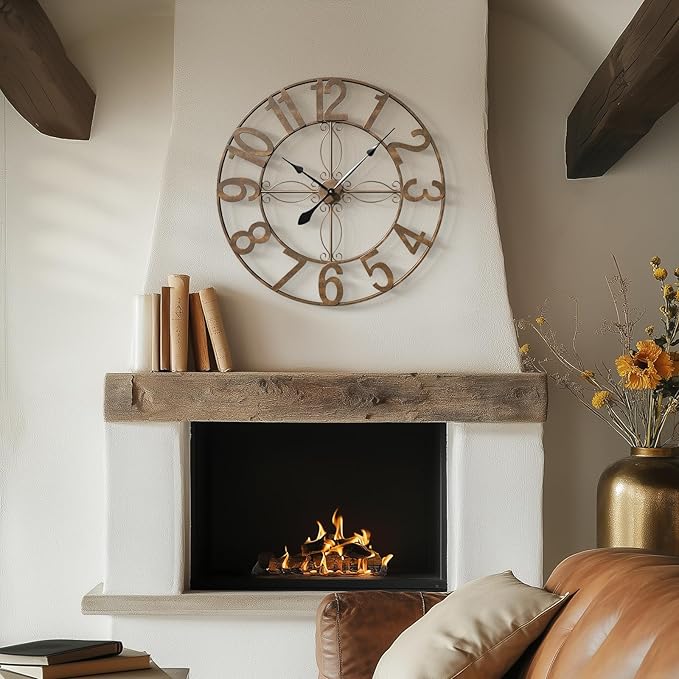 Fireplace with antique clock above, and books on the left.