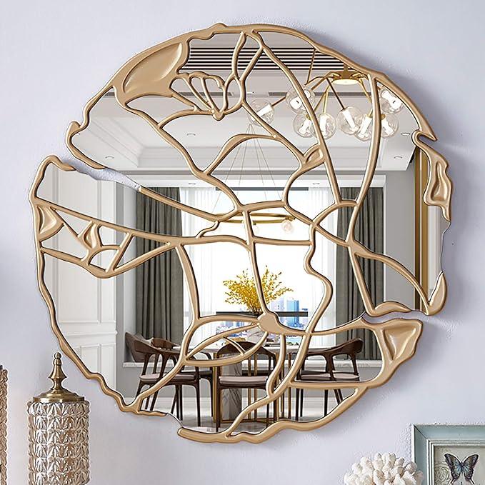 Gold luxury mirror with artistic design on a wall