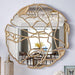 Gold luxury mirror with artistic design on a wall