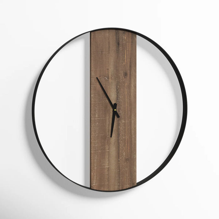 Round wall clock with wooden face and black frame on a white background