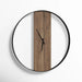 Round wall clock with wooden face and black frame on a white background
