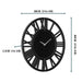 Black wall clock with measurements on a white background