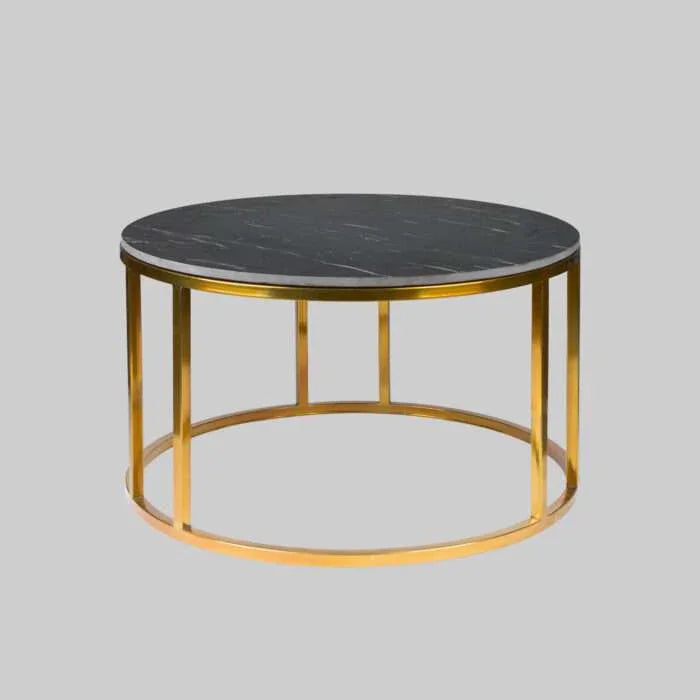 Round coffee table with marble top and gold metal frame on a gray background