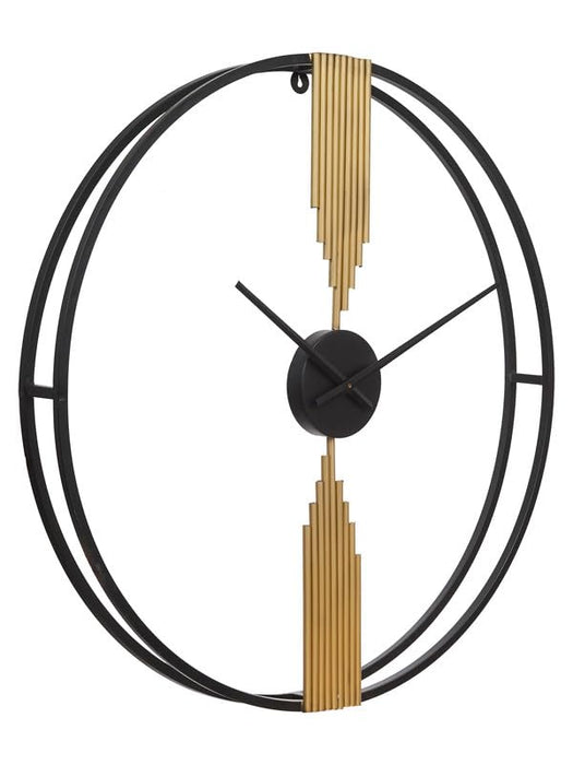 Decorative wall clock with black and gold design on a white background