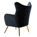 Modern black lounge chair with gold legs on a white background