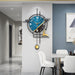 Modern wall clock with blue face and gold accents in a stylish interior setting.