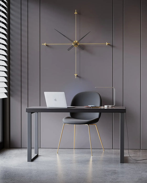 Modern office setup with a desk, chair, and clock on a dark wall.