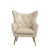 cream accent chair with gold legs on a white background