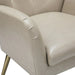 Close-up of a cream accent chair with a white background