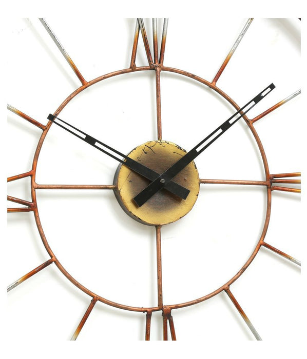 Decorative wall clock with metallic design and black hands on a white background