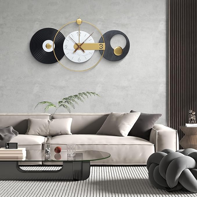 Modern living room with a decorative wall clock and gray sofa.
