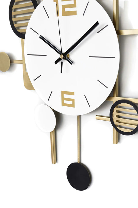 Decorative wall clock with gold and black design on a white background