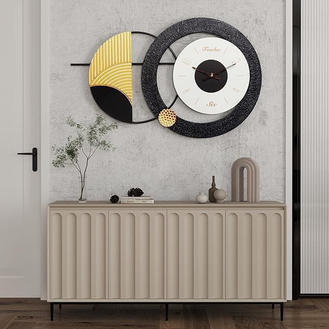 Decorative wall clock with geometric design on a wall above a cabinet.