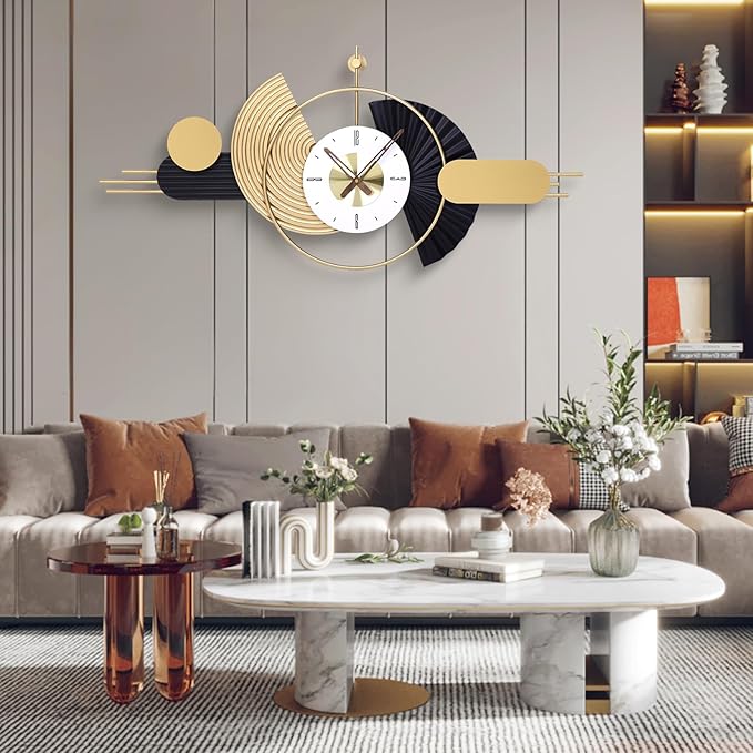 Decorative wall clock in a modern living room setting with a sofa and coffee table.