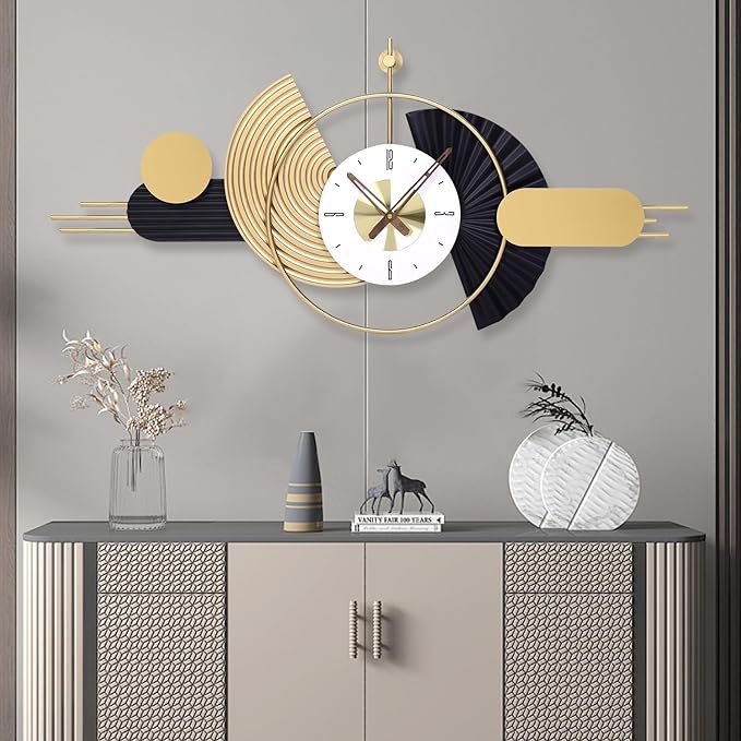 gold and black modern wall clock on the top of console table