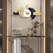 gold and black modern wall clock on entryway