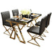 Dining table set with black chairs and gold legs on a white background